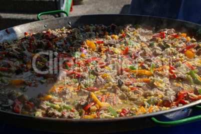 A dish of rice, vegetables and meat