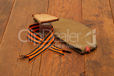 Holiday Victory Day background. George ribbon, military cap