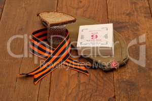 Holiday Victory Day background. George ribbon, military cap