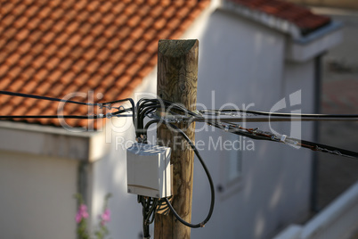 Distribution box on a high wooden power pole