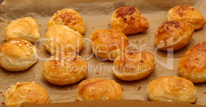 Freshly baked ruddy buns cool on the table