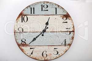 Old wooden wall clock on white background