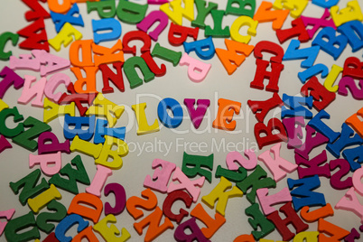 The word LOVE is composed of bright colored letters
