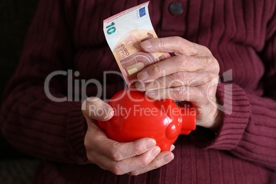 Retiree puts money in the piggy bank