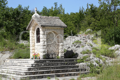 Small chapels built from white stone in Croatia