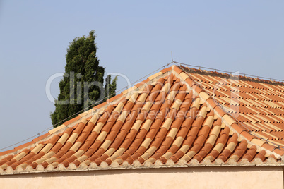 Red tile roof. Roof tiles on the roof