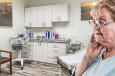 Worried Senior Adult Woman Waiting in Doctor Office