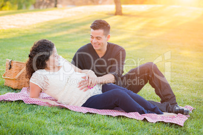 Hispanic Pregnant Young Couple Portrait Outdoors