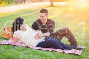 Hispanic Pregnant Young Couple Portrait Outdoors