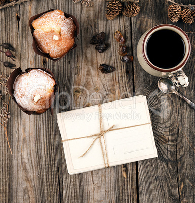 ropeed old paper postcards and ceramic mug with black coffee