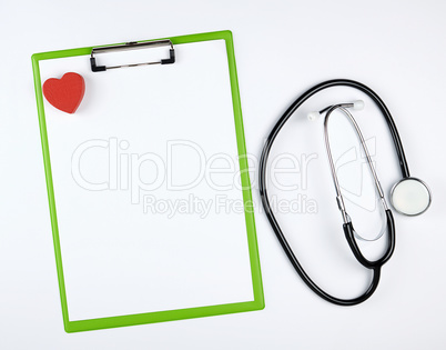 empty white sheets and medical stethoscope