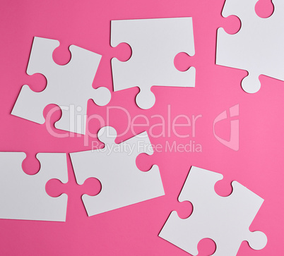 white large blank puzzles on a pink background