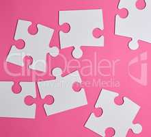 white large blank puzzles on a pink background