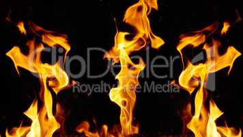 bright orange and yellow flames with sparks on black background