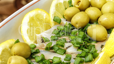 Herring with olives and lemons