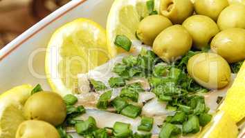 Herring with olives and lemons