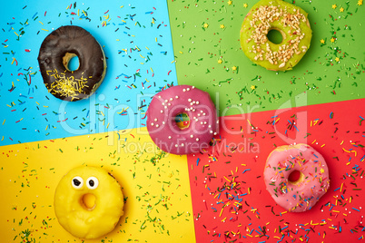 round donuts with various fillings and sprinkles