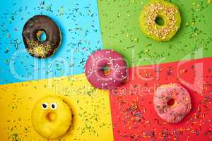round donuts with various fillings and sprinkles