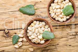 Pistachios nuts on wooden table