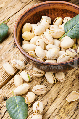Pistachios nuts on wooden table