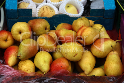 Beautiful yellow and red pears sold at the bazaar