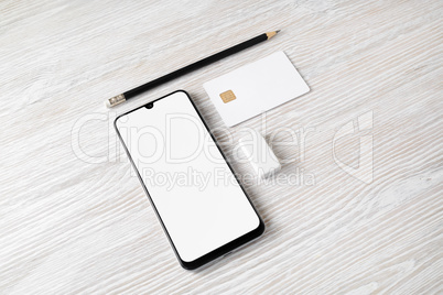 Smartphone, bank card, pencil, eraser