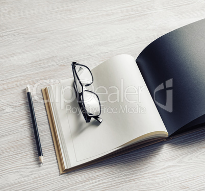 Booklet, glasses, pencil