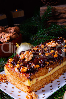 Chocolate gingerbread with filling, jam and nuts