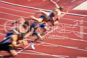 blurred start of runners in sprint