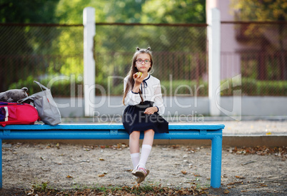 Schoolgirl on a bench