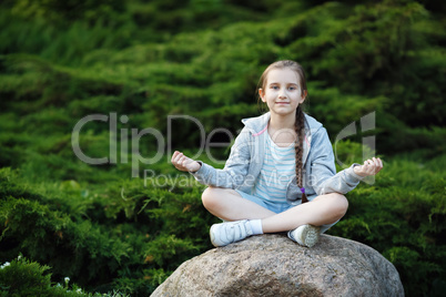 Child girl meditating