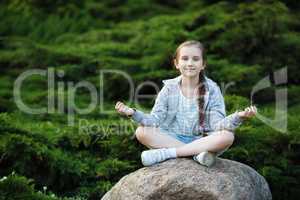 Child girl meditating