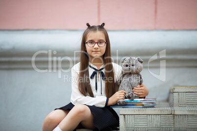 Schoolgirl with plush toy