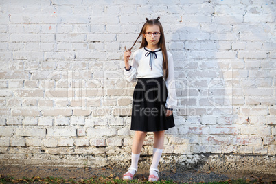 Schoolgirl in school uniform