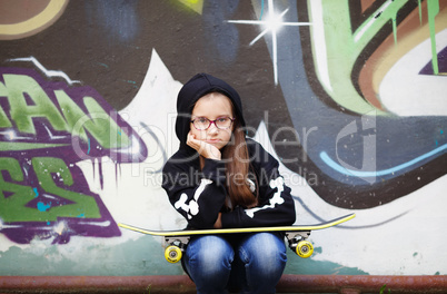 Child girl with skateboard