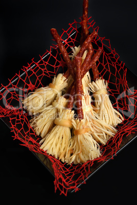 Witches Broom of smoked cheese suluguni and salami