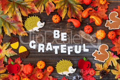 Colorful Autumn Decoration, Text Be Grateful, Wooden Background