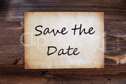 Old Paper, Text Save The Date, Wooden Background