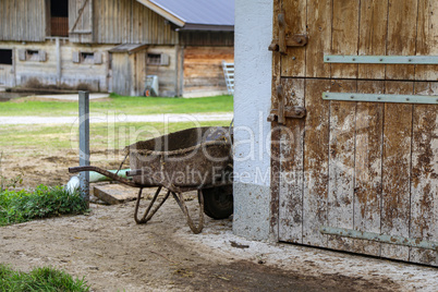 A wooden shed on a farm plot in the village