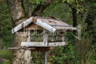 Handmade wooden bird feeder made of birch