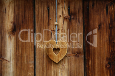 Wooden heart for happiness on wooden doors