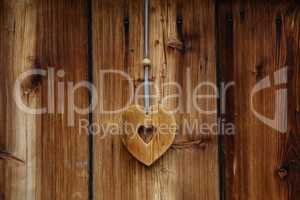 Wooden heart for happiness on wooden doors
