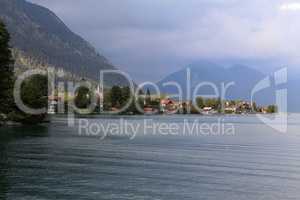 Cloudy day at lake Walchensee with Herzogstand mountain Jochberg, Germany