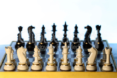 chess pieces stand on the board before the start of the new game