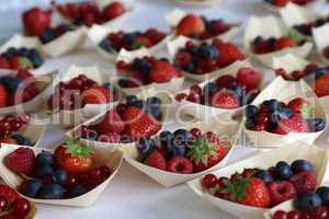 Fresh berries for dessert - raspberries, strawberries, blueberries