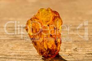 Amber in sun with inclusions