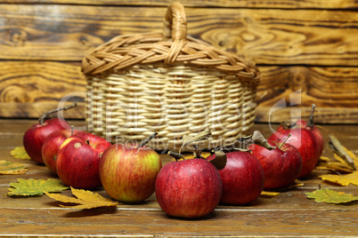 Composition of ripe red apples on a blurred background