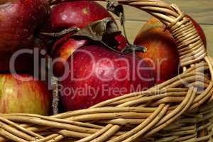 Arrangement of ripe red apples lying in a basket