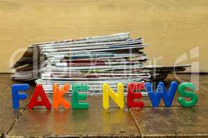 Fake news concept with newspapers and letters