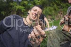 Boy holds out a joint 2